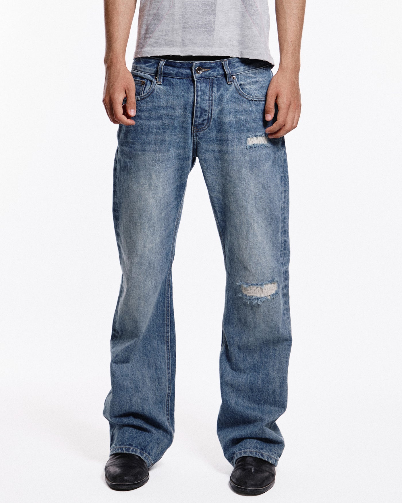 'Repaired' Washed blue jeans